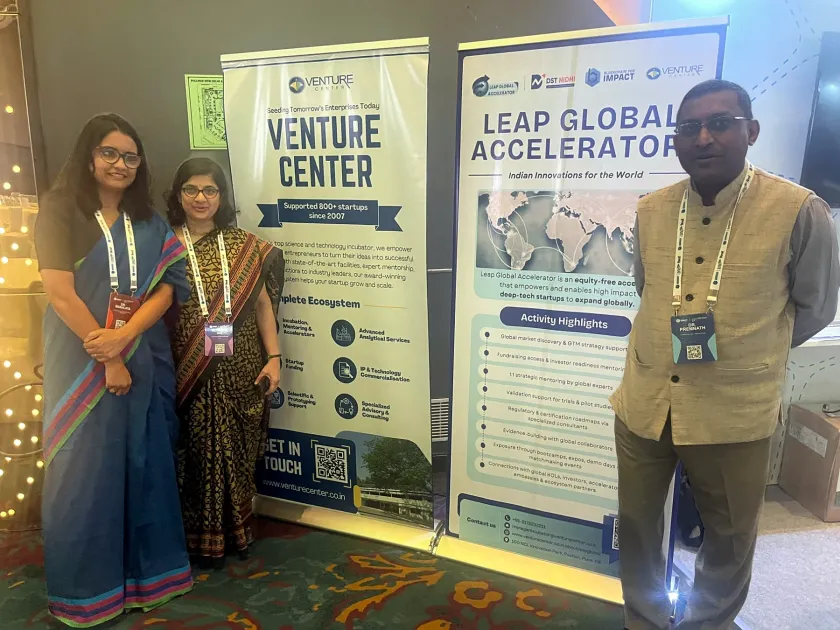 Snahlata Singh and two others beside Venture Center and Leap Global Accelerator banners.